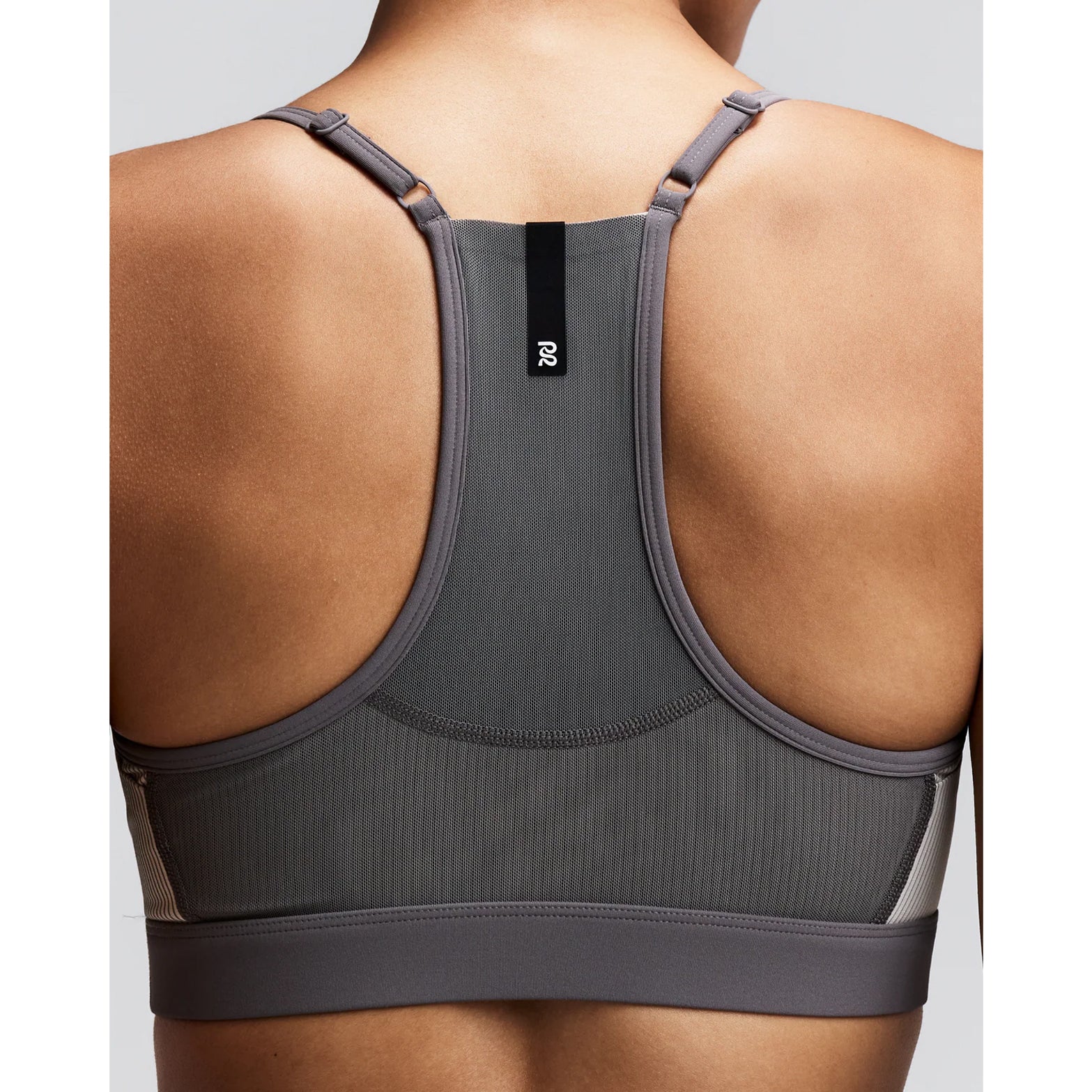 Women's Bandit Striped Cadence Strappy Bra Plaster Slate close-up of back showing Powermesh panel with waterproof centre back phone pocket and reflective details for running visibility