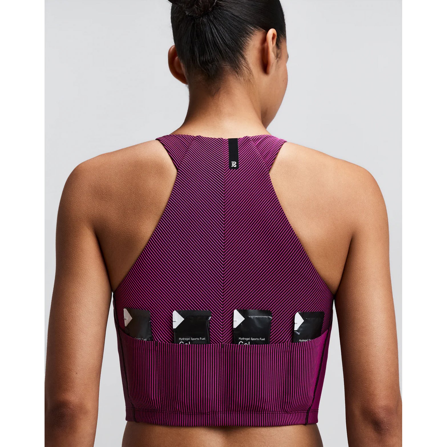 Women's Bandit Striped Cadence Zip Front Race Crop Espresso Azalea close-up of pocket system showing three waterproof phone pockets and four gel pockets with zero-bulk design for race day essentials