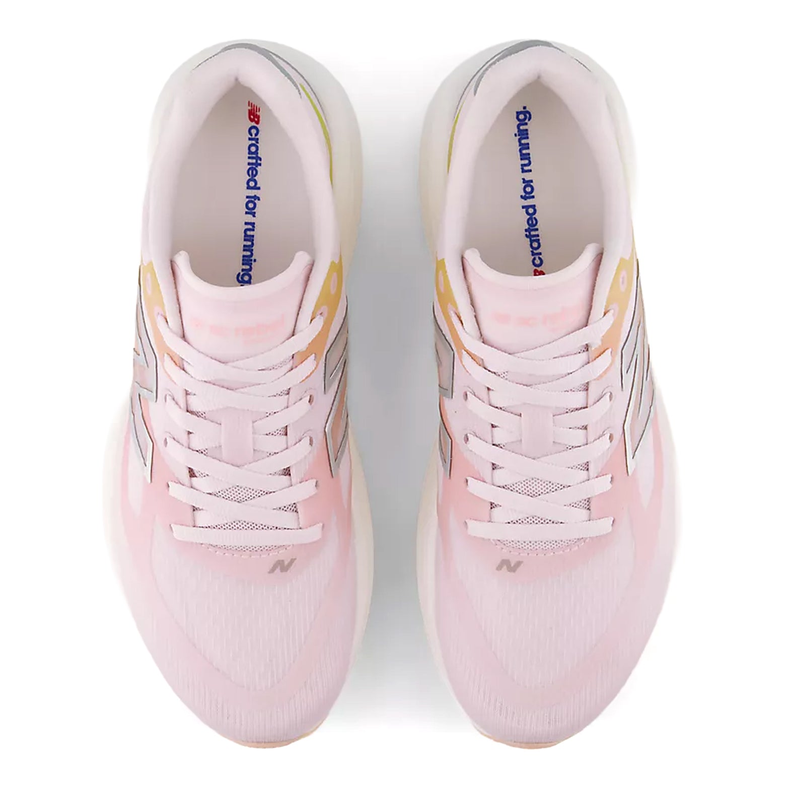 Women's New Balance SuperComp Rebel Running Shoes Pink Chalk Pink Lemonade top view showing soft flexible upper with FantomFit technology for lightweight secure midfoot and heel lockdown during training and racing