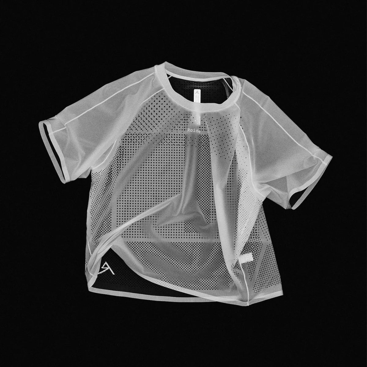 Women's Raide Thermal Dispersion Tee Black negative product shot highlighting body-mapped laser-cut perforation pattern showing concentrated centre back ventilation zones and strategic hole placement for maximum evaporative cooling during running