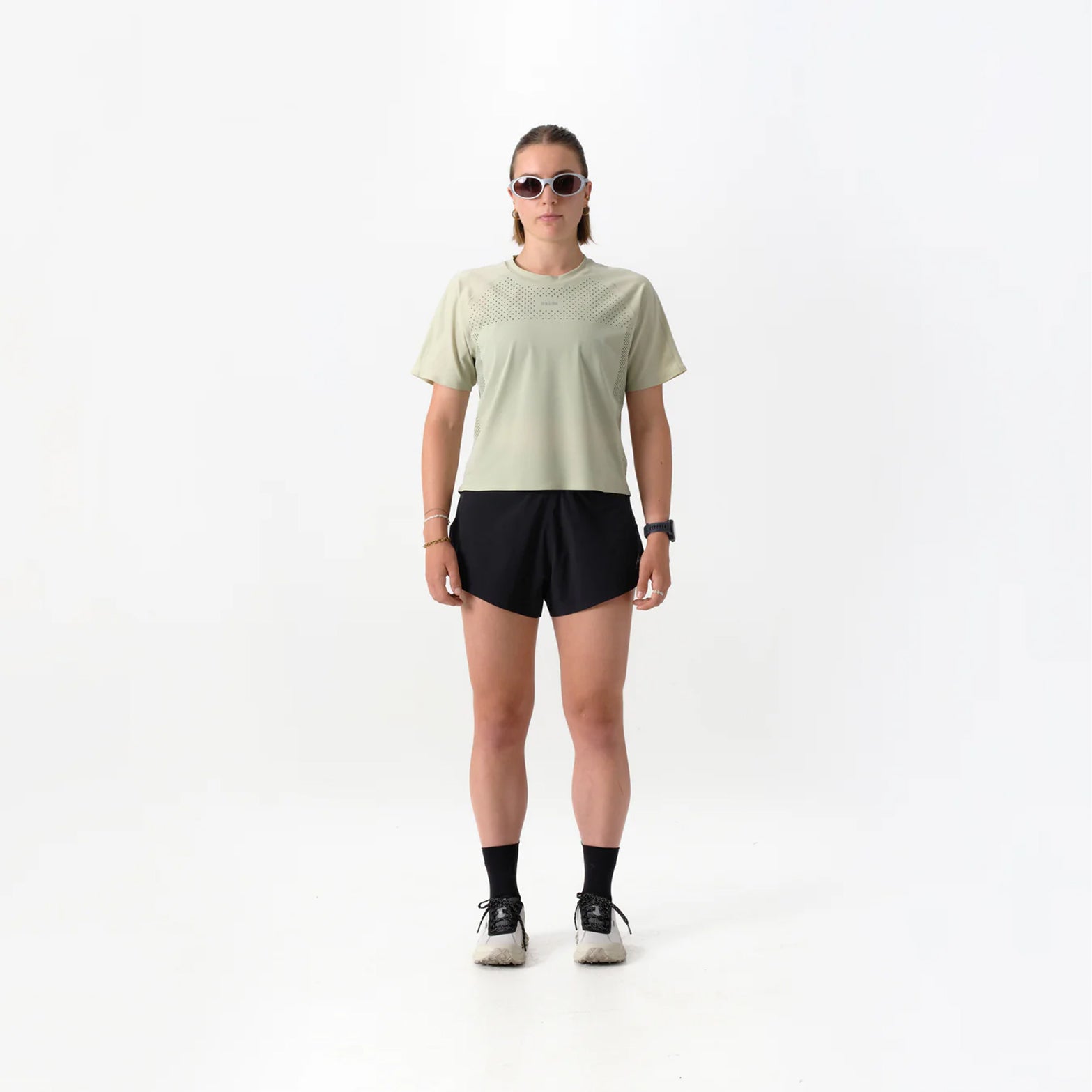 Women's Raide Thermal Dispersion Tee Lichen front full body view on female runner showing cool-to-touch Italian microfibre with four-way stretch and body-mapped perforations for lightweight warm weather training