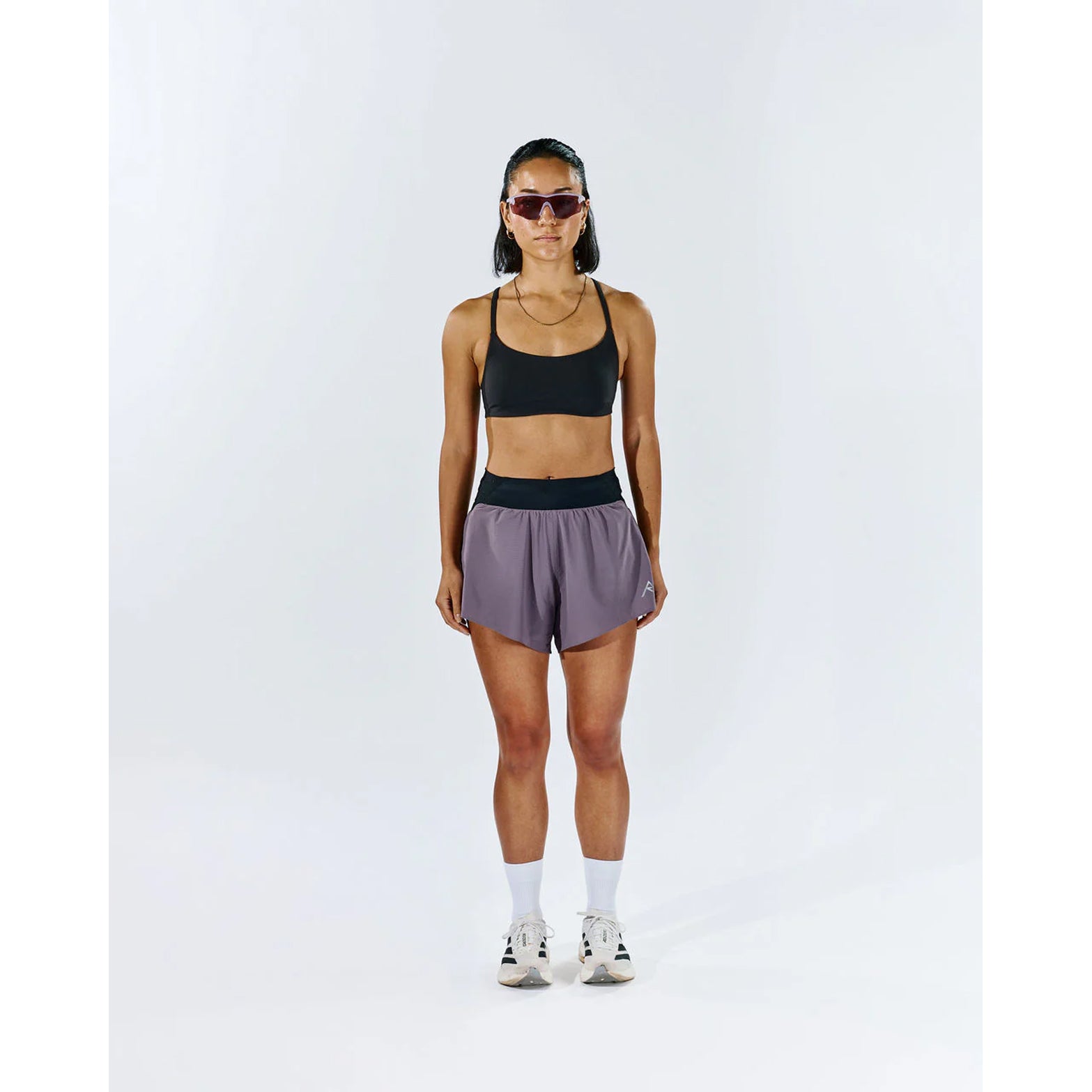 Raide TrailTech Short women's in Dusk — full body front view worn on model showing 3 inch silhouette, laser-perforated waistband and pocket placement in motion on trail