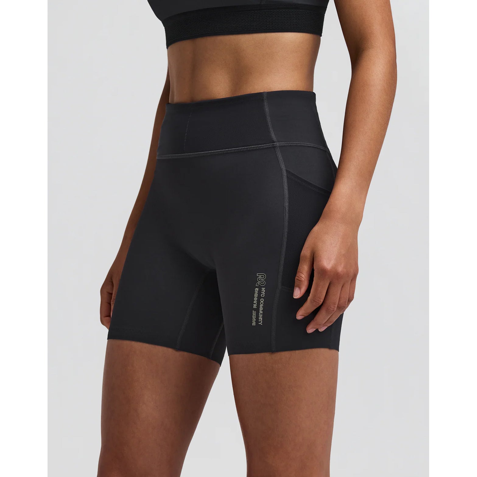 Women's Bandit Vanisher 5 Inch High Waist Compression Shorts Anthracite side view on female runner showing high waist Vanisher compression with GripDot hems and waterproof leg pocket for comfortable race day performance