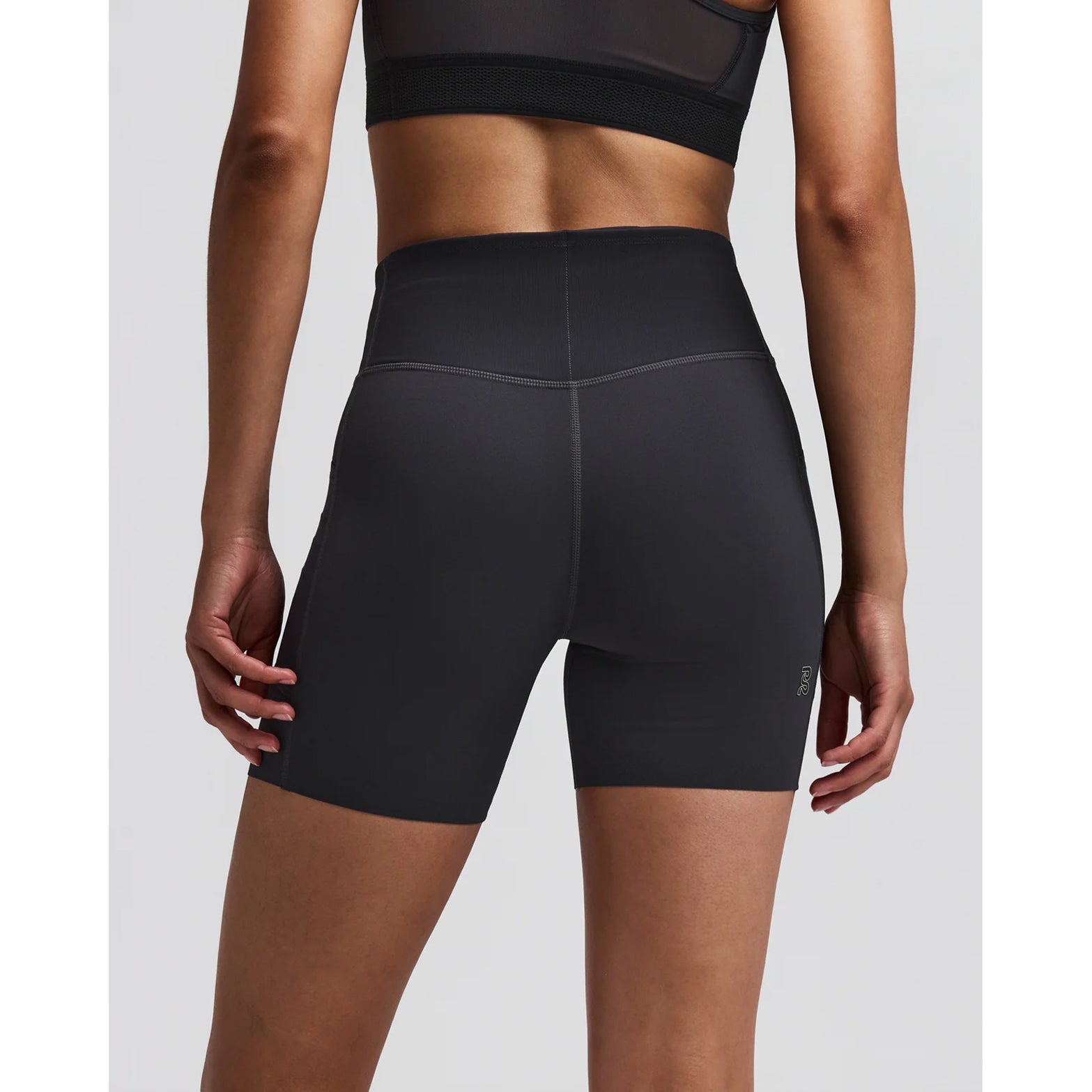Women's Bandit Vanisher 5 Inch High Waist Compression Shorts Anthracite back view on female runner showing Powermesh back pocket with waterproof phone pocket and two-tone branding