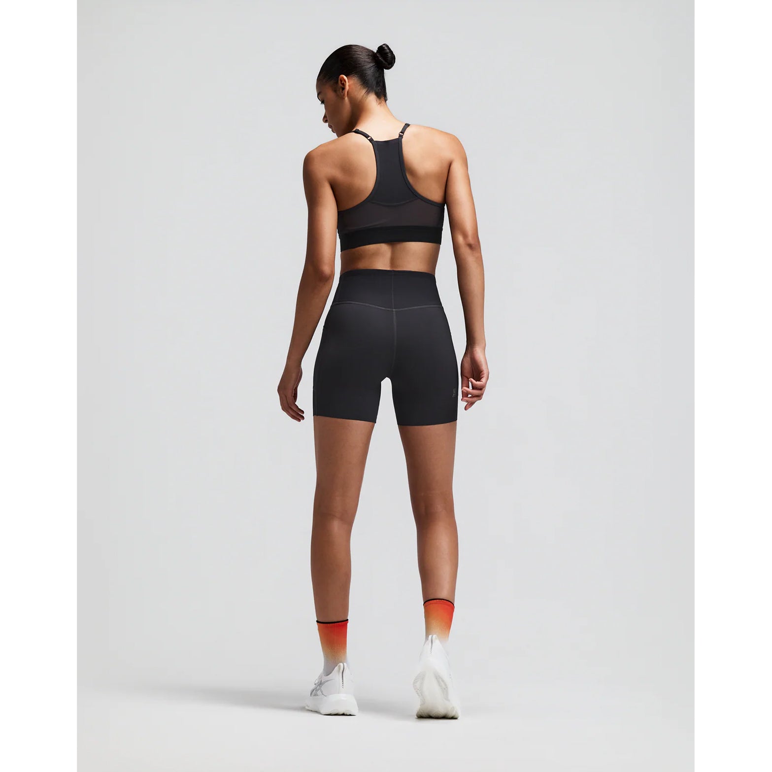 Women's Bandit Vanisher 5 Inch High Waist Compression Shorts Anthracite back full body view on female runner showing GripDot laser-cut hems with waterproof centre back pocket and Vanisher compression construction