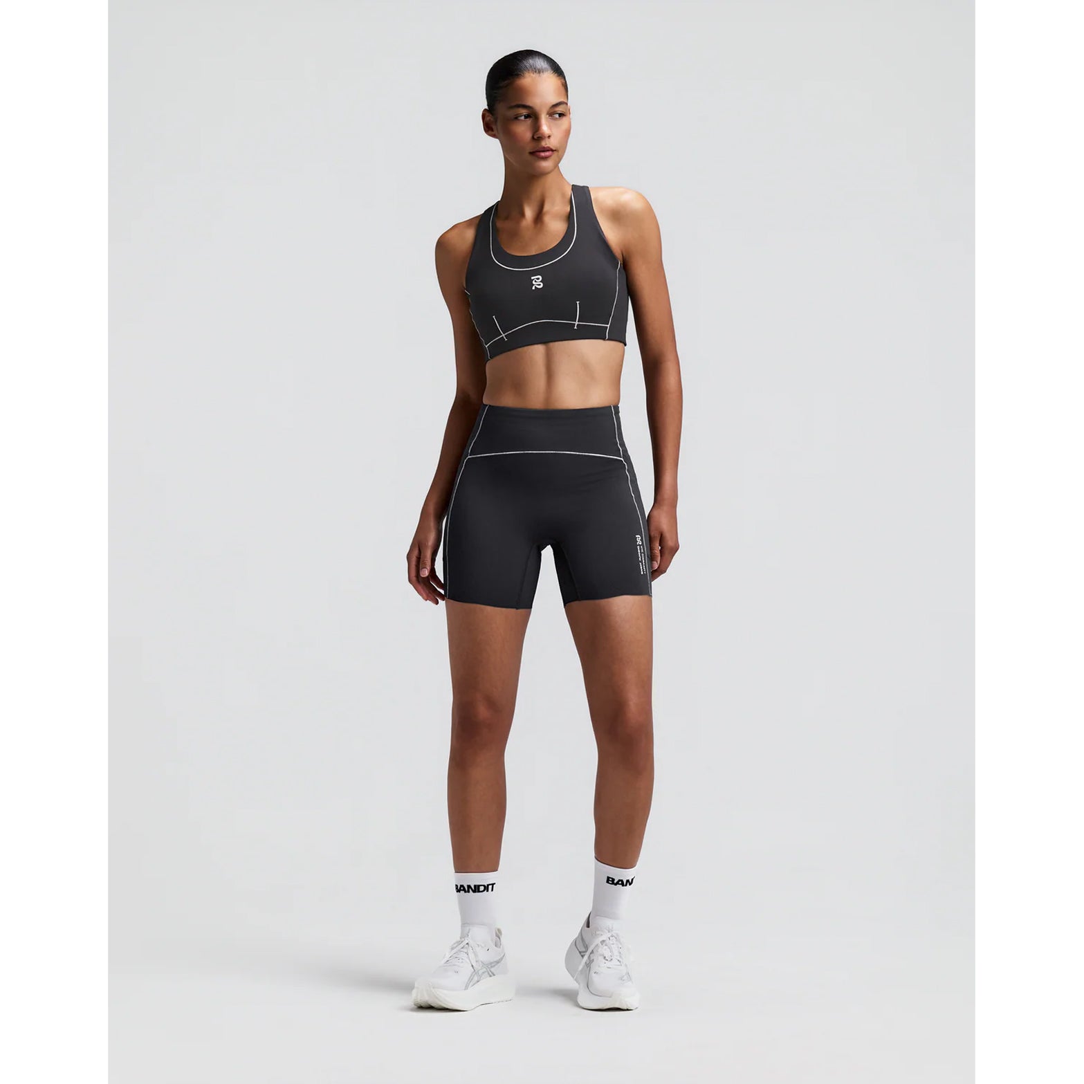 Women's Bandit Vanisher Pop Stitch 5 Inch High Waist Compression Shorts Anthracite front full body view on female runner showing high waist Vanisher compression with Pop Stitch detail and seven-pocket system for racing and training