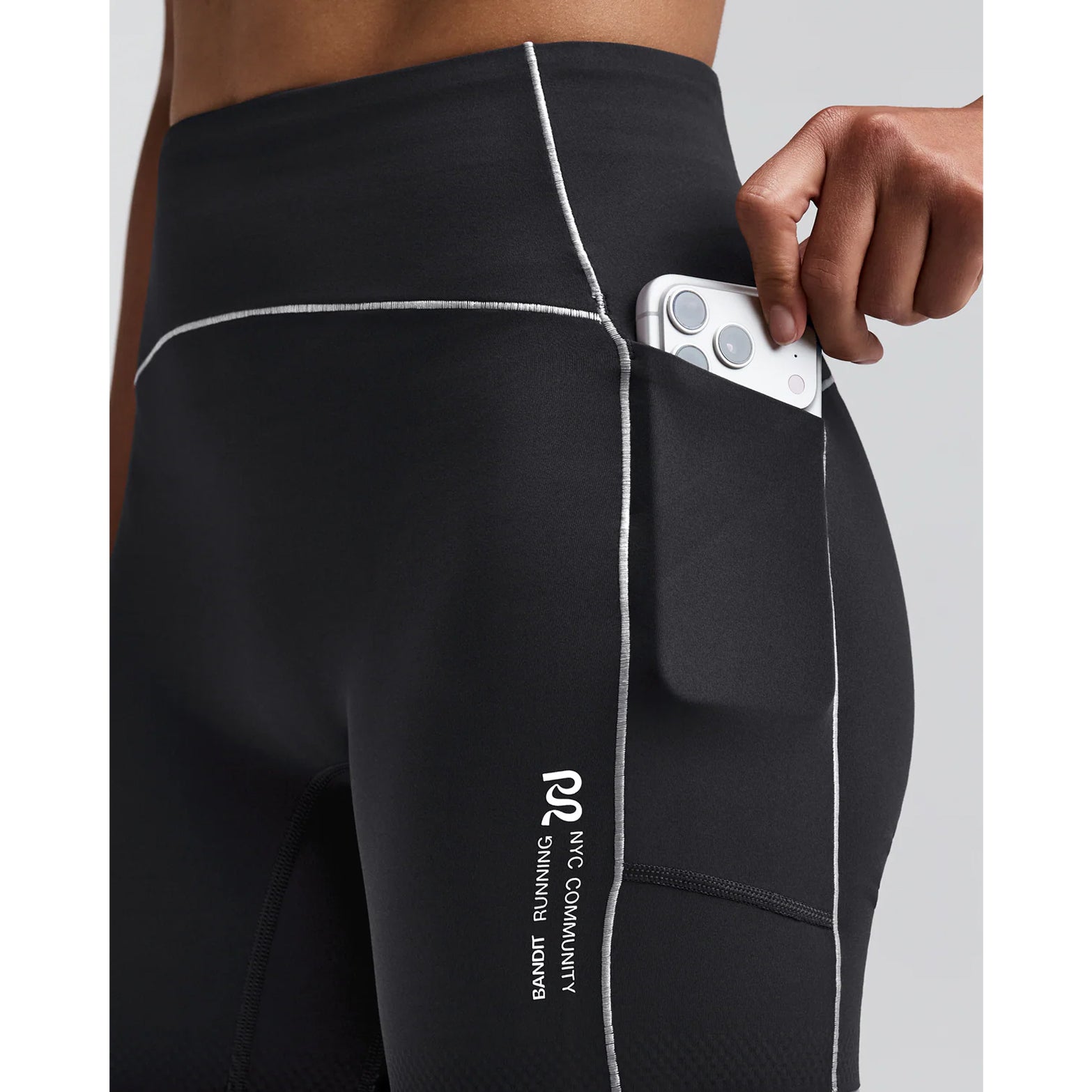 Women's Bandit Vanisher Pop Stitch 5 Inch High Waist Compression Shorts Anthracite close-up of waterproof side leg phone pocket showing secure hidden storage with zero-bulk design for race day essentials without bounce