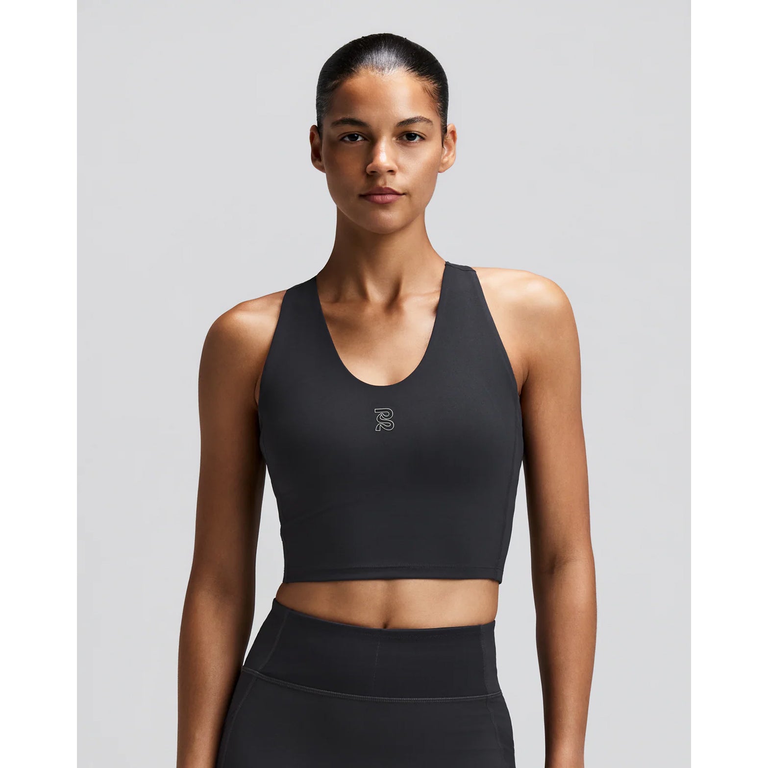 Women's Bandit Vanisher V-Neck Race Crop Top Anthracite front view on female runner showing v-neck crop design with Vanisher sweat-hiding compression and waterproof phone pockets