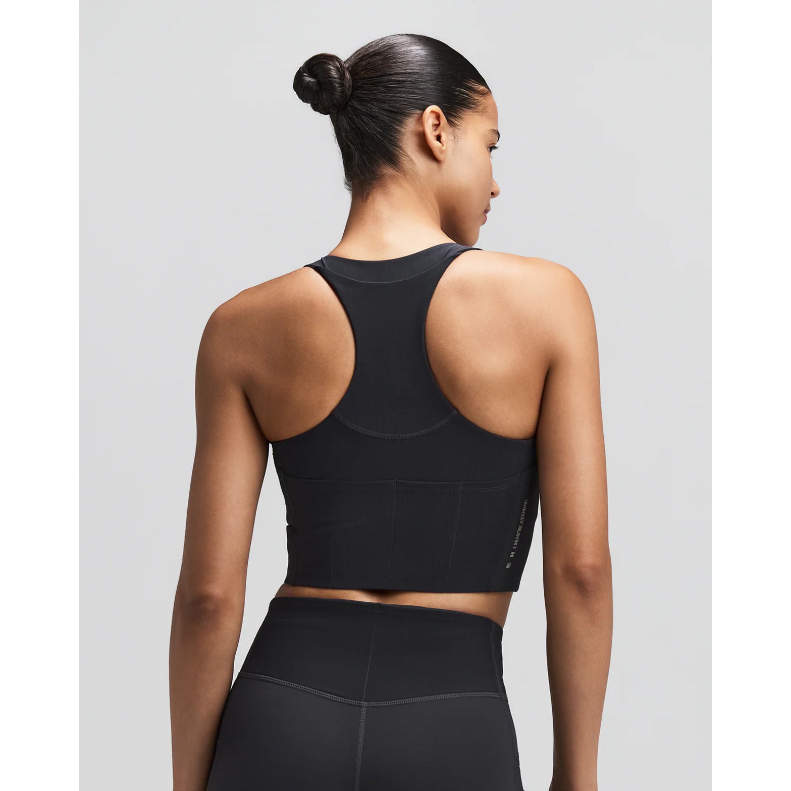 Women's Bandit Vanisher V-Neck Race Crop Top Anthracite back view on female runner showing Powermesh back panel with two-tone reflective branding and structured support