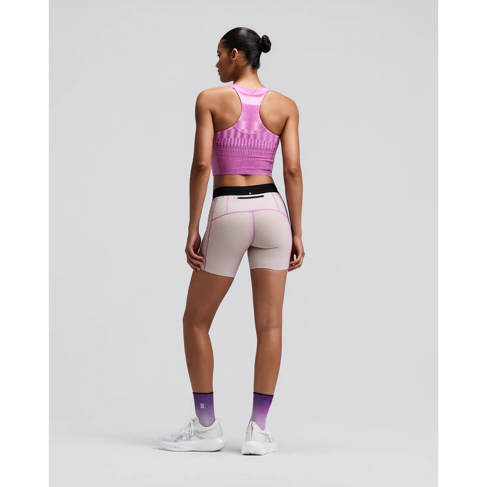 Women's Bandit Vanisher V-Neck Race Crop Top Growing Grid Orchid back full body view on female runner showing Powermesh back panel with reflective branding and Vanisher compression construction for race day performance