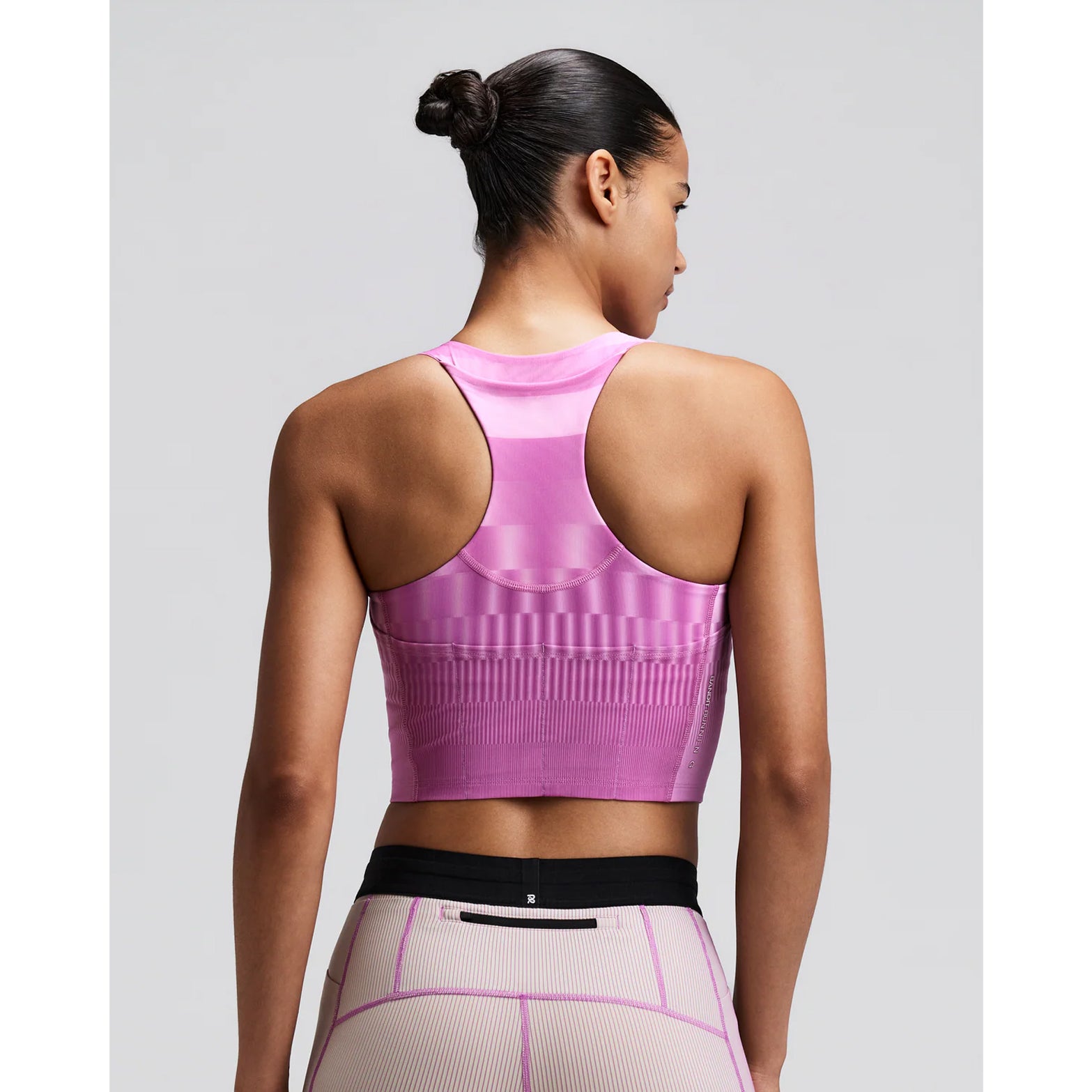 Women's Bandit Vanisher V-Neck Race Crop Top Growing Grid Orchid back view on female runner showing Powermesh back panel with two-tone reflective branding and structured support