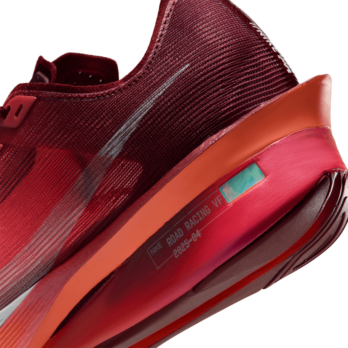 Women's Nike Vaporfly 4 SE Running Shoes Team Red Bright Crimson Barely Green angled side and heel view showing carbon-plated ZoomX foam construction for elite racing from 5K to marathon