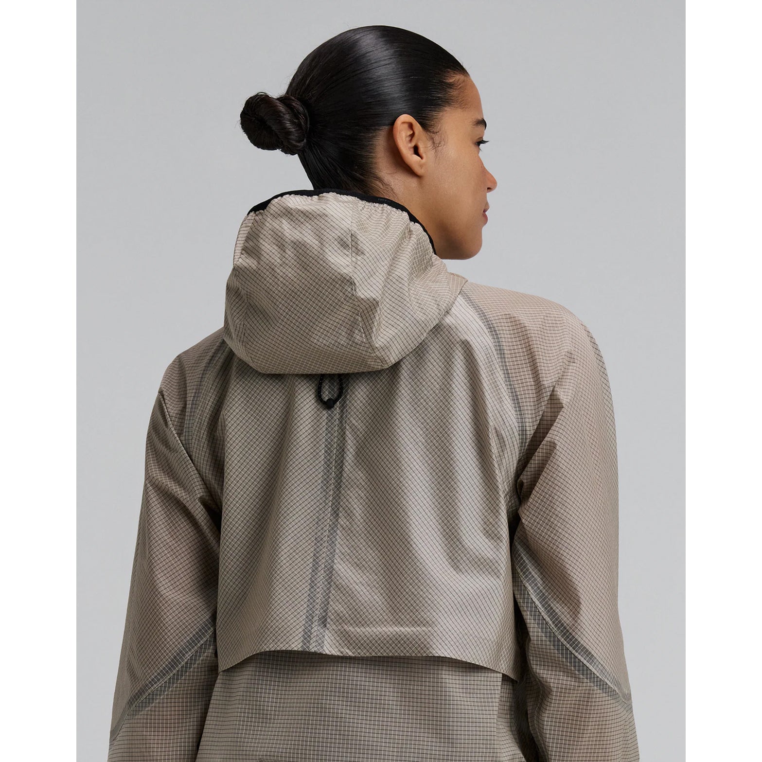 Women's Bandit VeloRip Ultralight Windproof Jacket Oatmeal back view showing taped bonded seams, reflective branding and woven infographic label at centre back neck