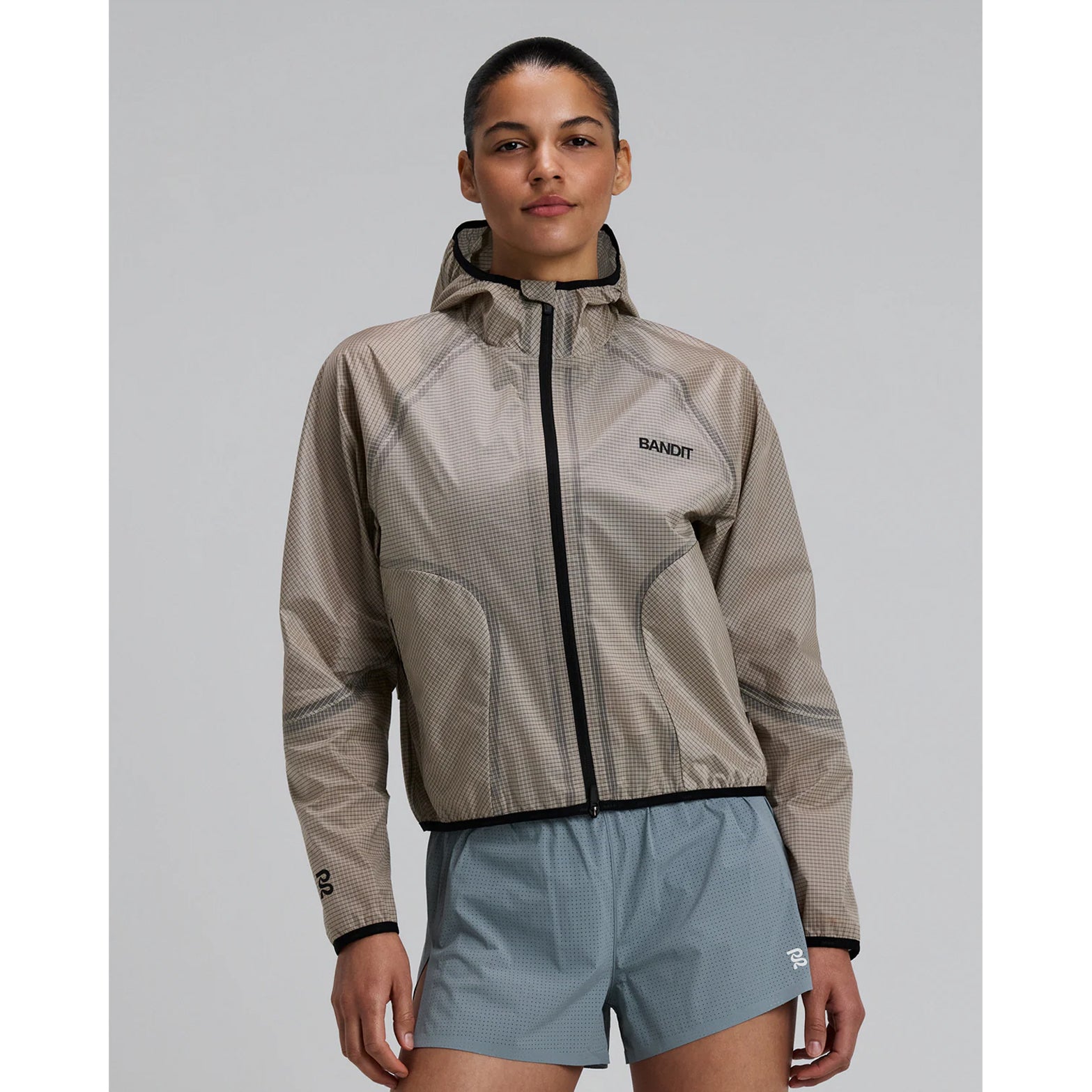 Women's Bandit VeloRip Ultralight Windproof Jacket Oatmeal front view showing 2-way centre-front zipper with reflective branding and ultra-light featherweight construction