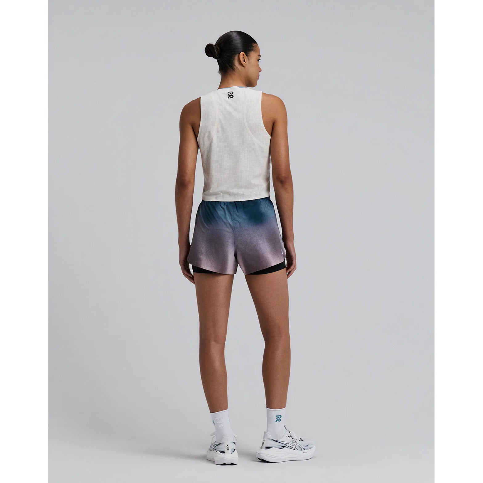 Bandit Vento™ 2-in-1 Run Short women's in Flow State Aegean Multi — full body back view worn on model showing Vento™ micro-perforated fabric construction, gel pocket placement and flow state aegean multi colourway in motion