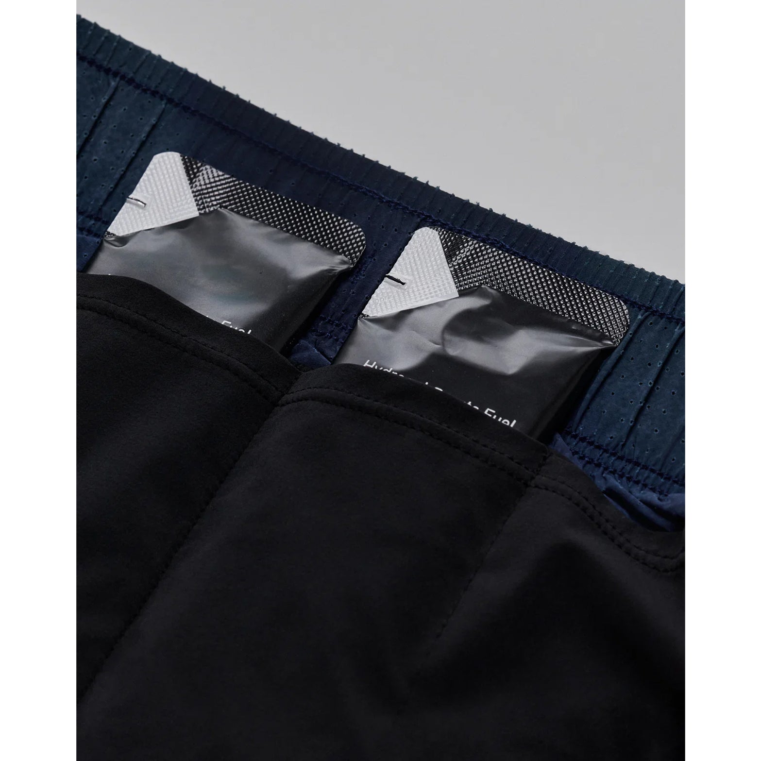 Bandit Vento™ 2-in-1 Run Short women's in Flow State Aegean Multi — closeup showing dedicated gel pockets integrated into the SoLite™ compression liner construction