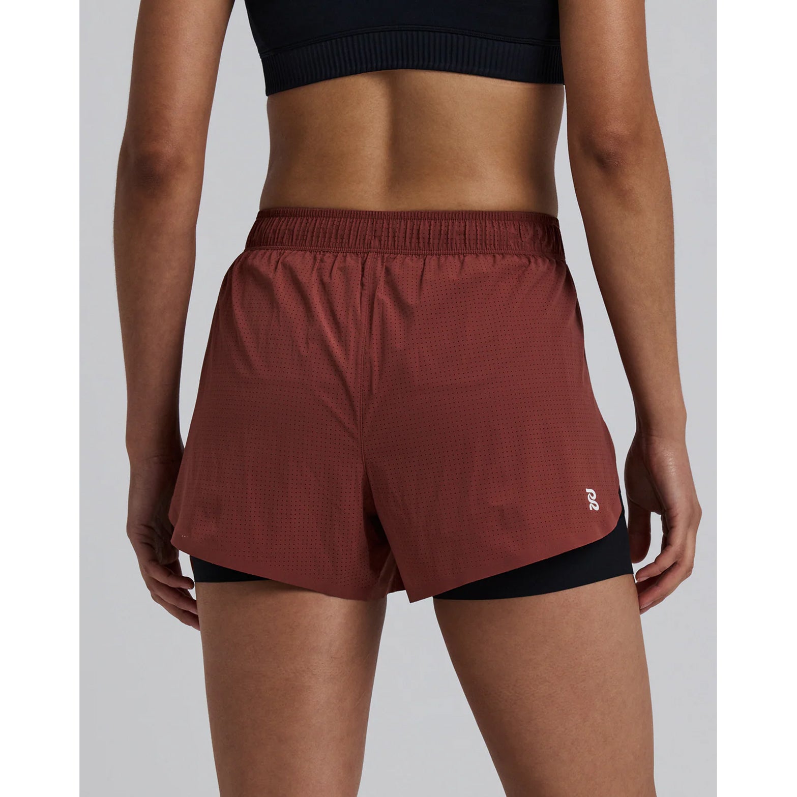 Women's Bandit Vento 2-in-1 Run Short Mahogany Black back view showing waterproof phone pockets, gel storage and reflective branding for visibility