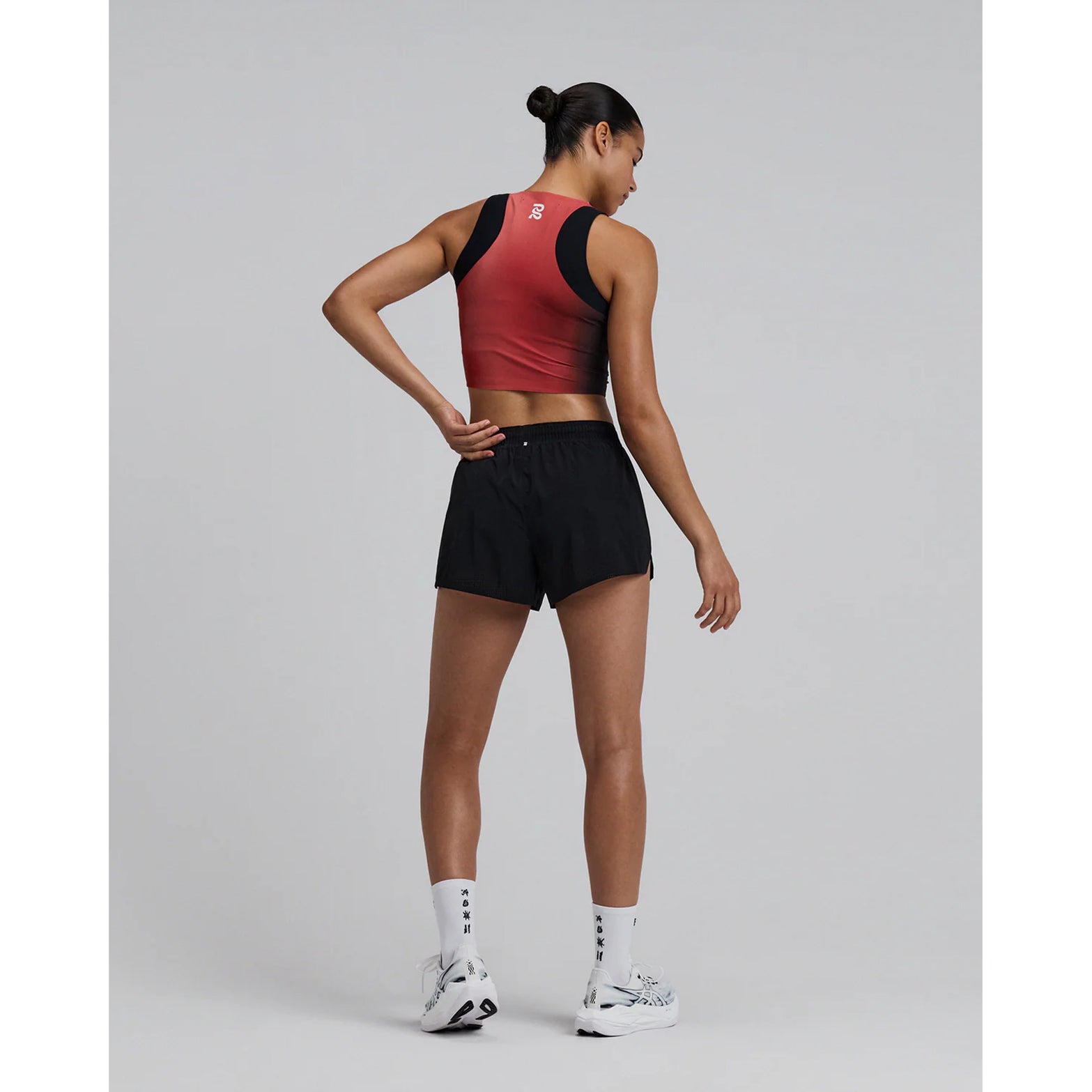 Bandit Vento™ Next Gen 3 Inch Split Shorts women's in Black — full body back view worn on model showing bonded cutaway split, gel pocket placement and Coolcore™ brief construction in motion