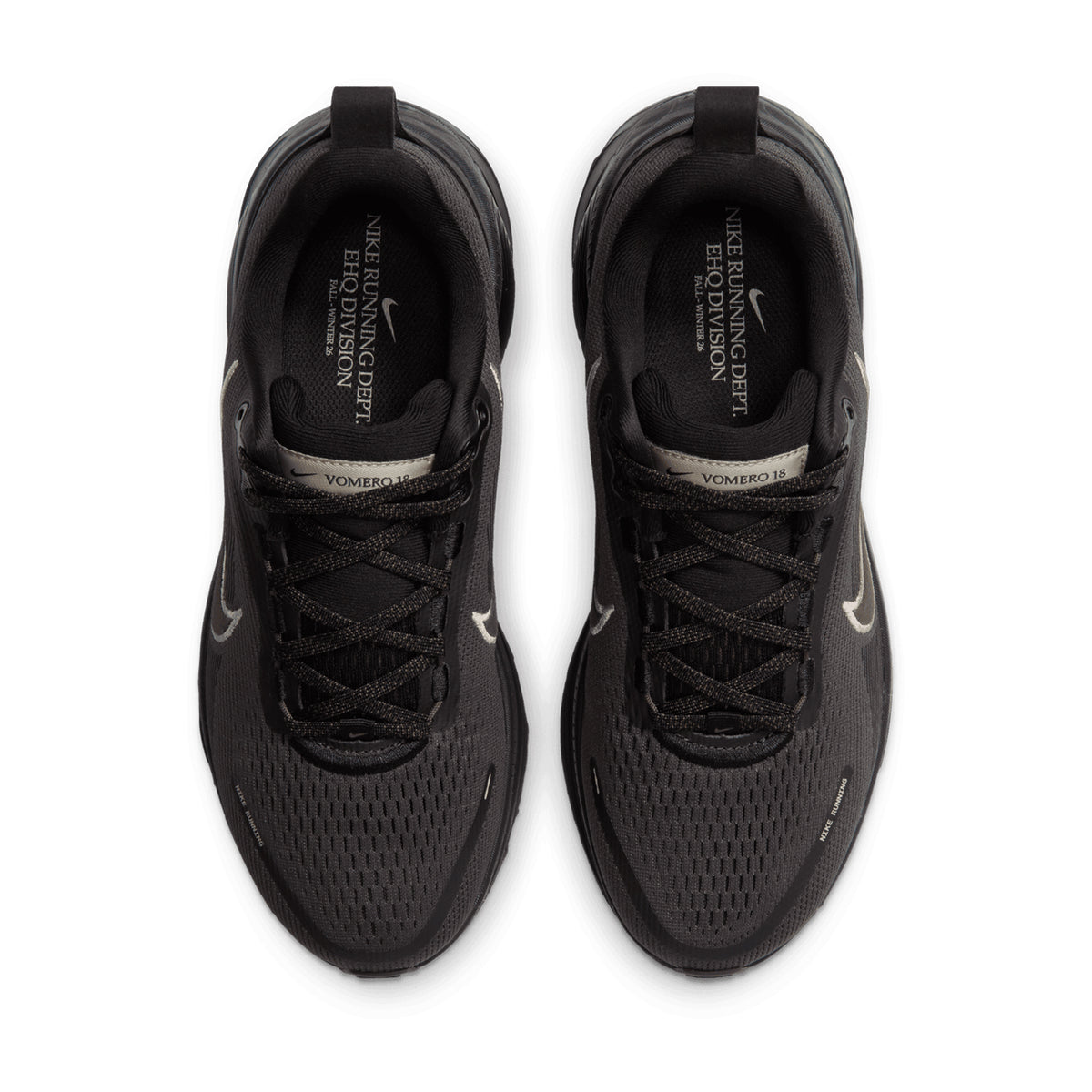 Top-down view of a pair of Women’s Vomero 18 Running Shoes in Medium Ash, Dark Hazel, Black, and Desert Khaki, featuring black laces and tan accents.