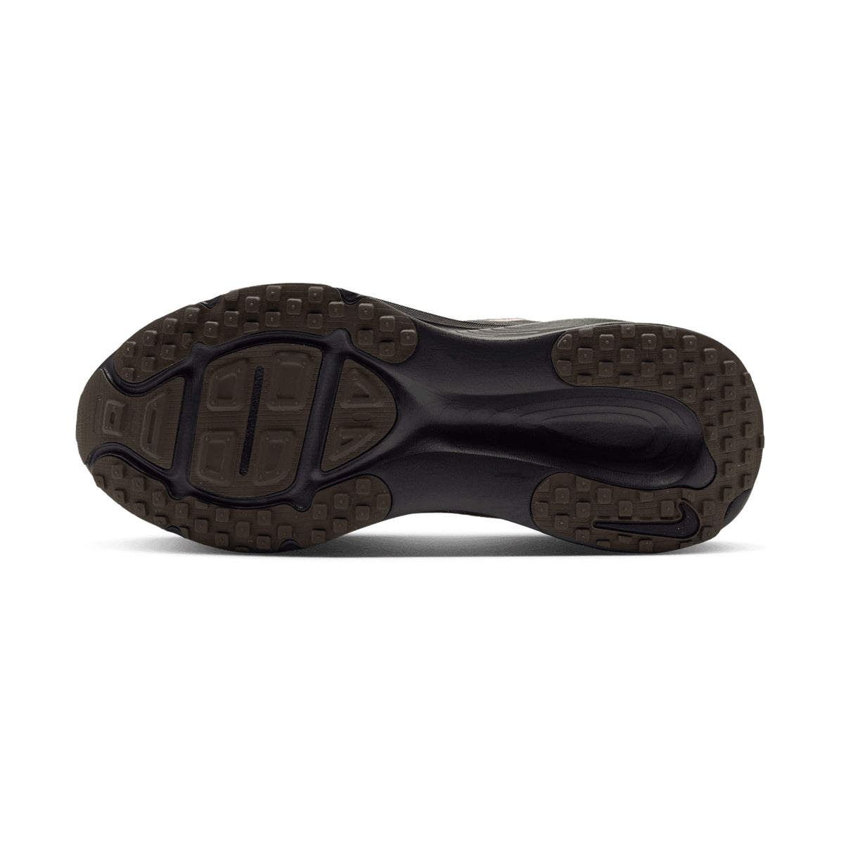 The dark brown rubber outsole of a Women’s Vomero 18 Running Shoes Medium Ash / Dark Hazel / Black / Desert Khaki, featuring a textured tread pattern and a recessed arch.