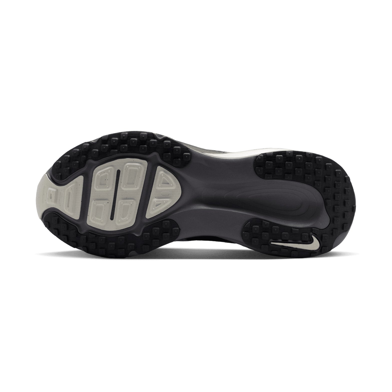 Nike Vomero 18 SE women's running shoe in Phantom / Sail / Pencil Point — outsole view showing redesigned traction pattern, strategic outsole pods and pencil point ReactX midsole stack