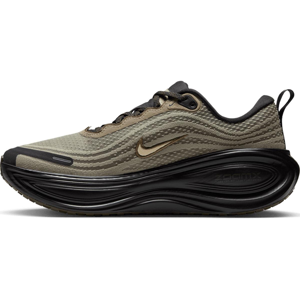 Matte Olive, Black, and Desert Khaki Women’s Vomero Plus Running Shoes featuring a thick, sculpted black sole with ZoomX cushioning and a small metallic swoosh logo.