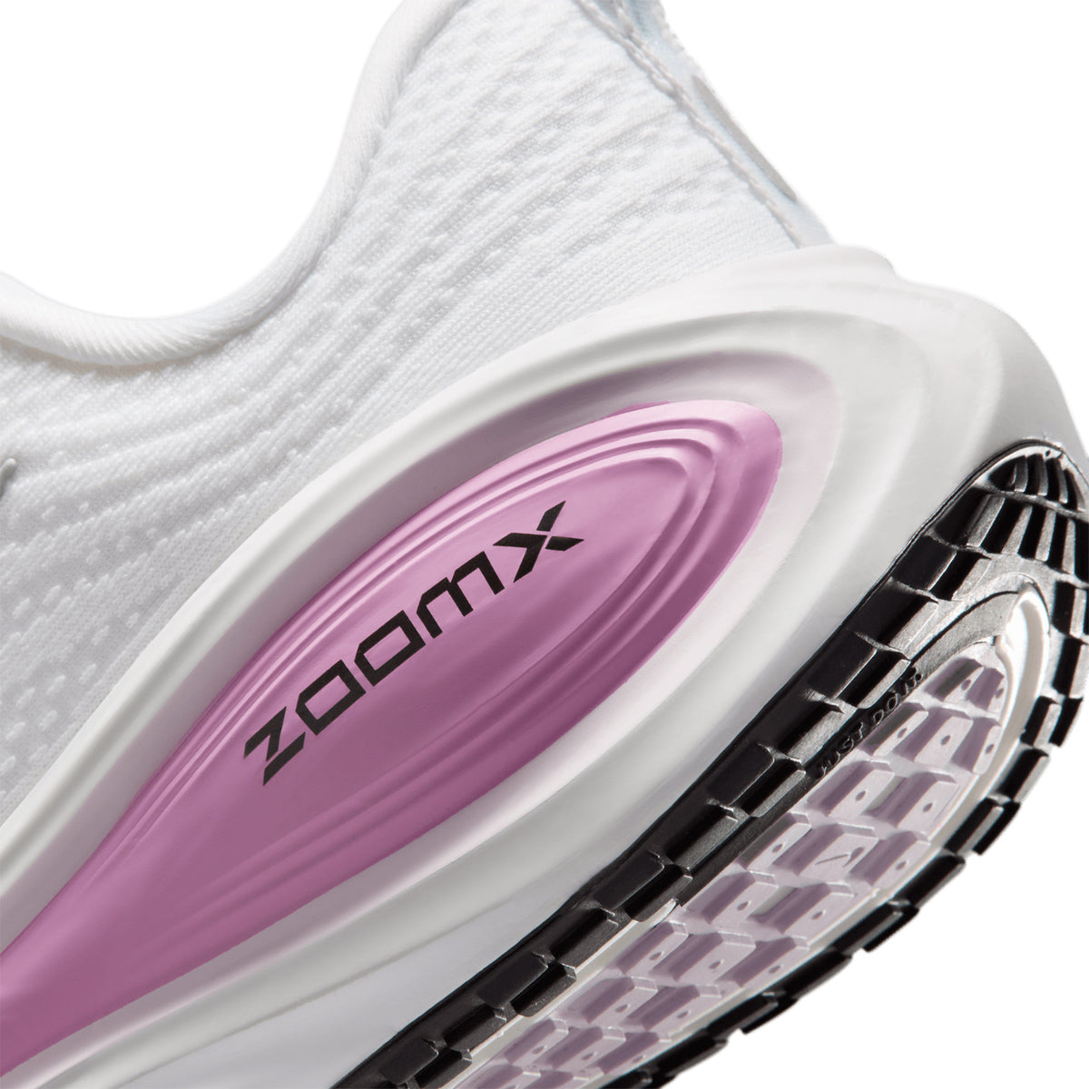 Women's Nike Vomero Plus Running Shoes White Bleached Lilac Summit White Metallic Silver angled side and heel view showing full-length ZoomX foam with high-abrasion outsole and soft breathable mesh upper for maximum cushioned everyday road running
