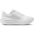 Nike Vomero Plus women's running shoe in White / Photon Dust / Metallic Silver / Summit White — outer view showing white engineered mesh upper with photon dust, metallic silver and summit white accent detailing and cushioning midsole profile