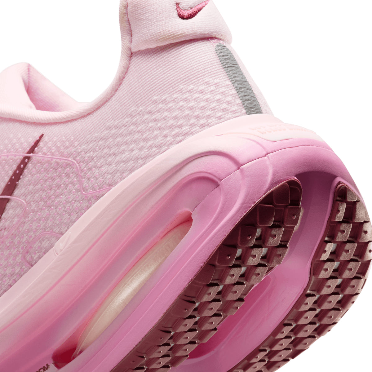 Nike Vomero Premium women's running shoe in Pink Foam / Pink Rise / Light Magenta / Pink Smoke — angled side view showing pink foam engineered mesh upper, responsive cushioning design and pink rise cushioning midsole stack