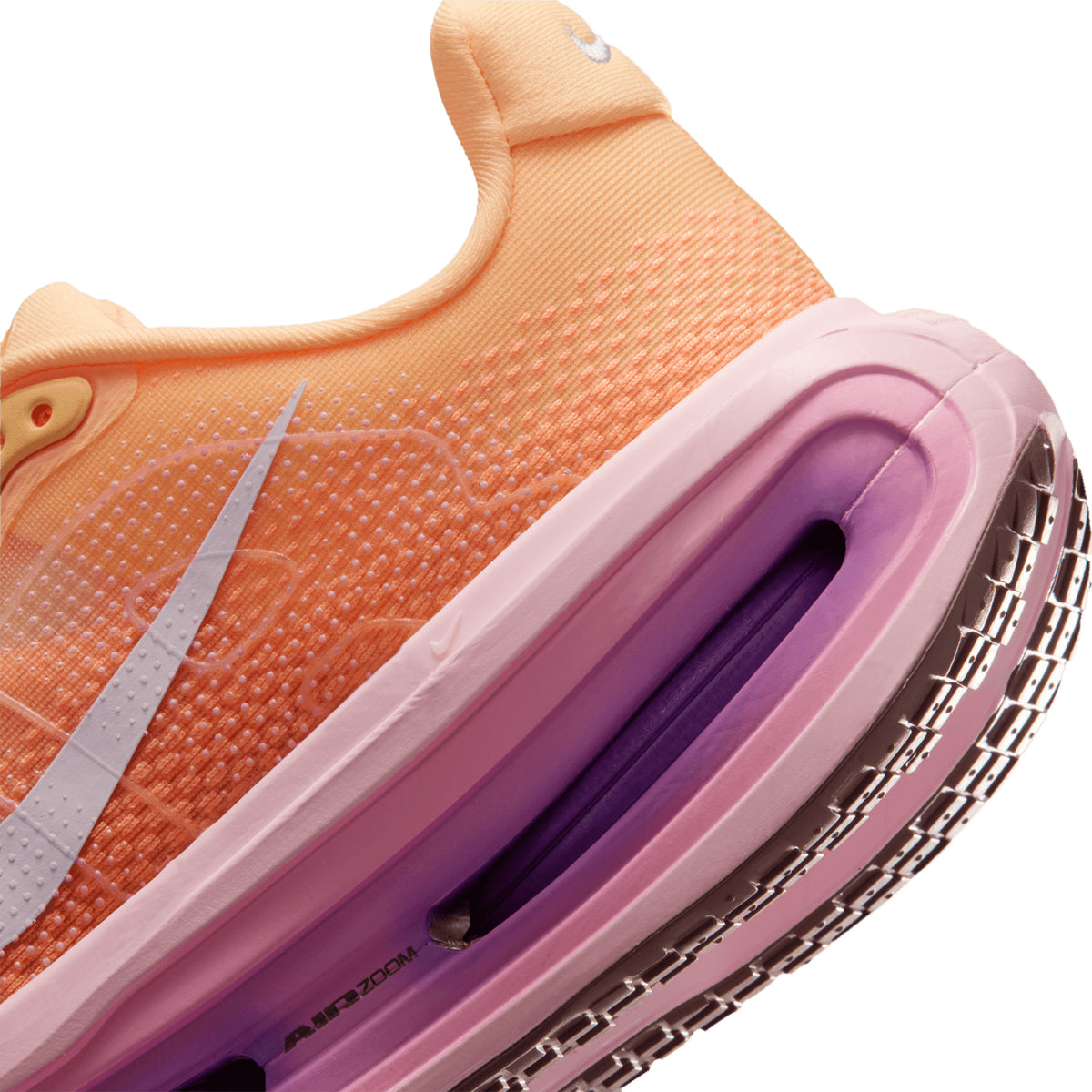 Women's Nike Vomero Premium Running Shoes Orange Pink angled side and heel view showing dual Air Zoom technology, ZoomX foam platform and ultrasoft yet springy ride construction