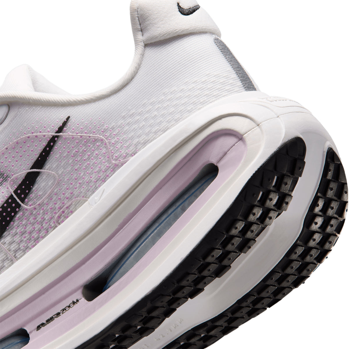 Women's Nike Vomero Premium Running Shoes White Summit White Bleached Lilac Black angled side and heel view showing dual Air Zoom units surrounded by ZoomX foam for plush springy daily road running