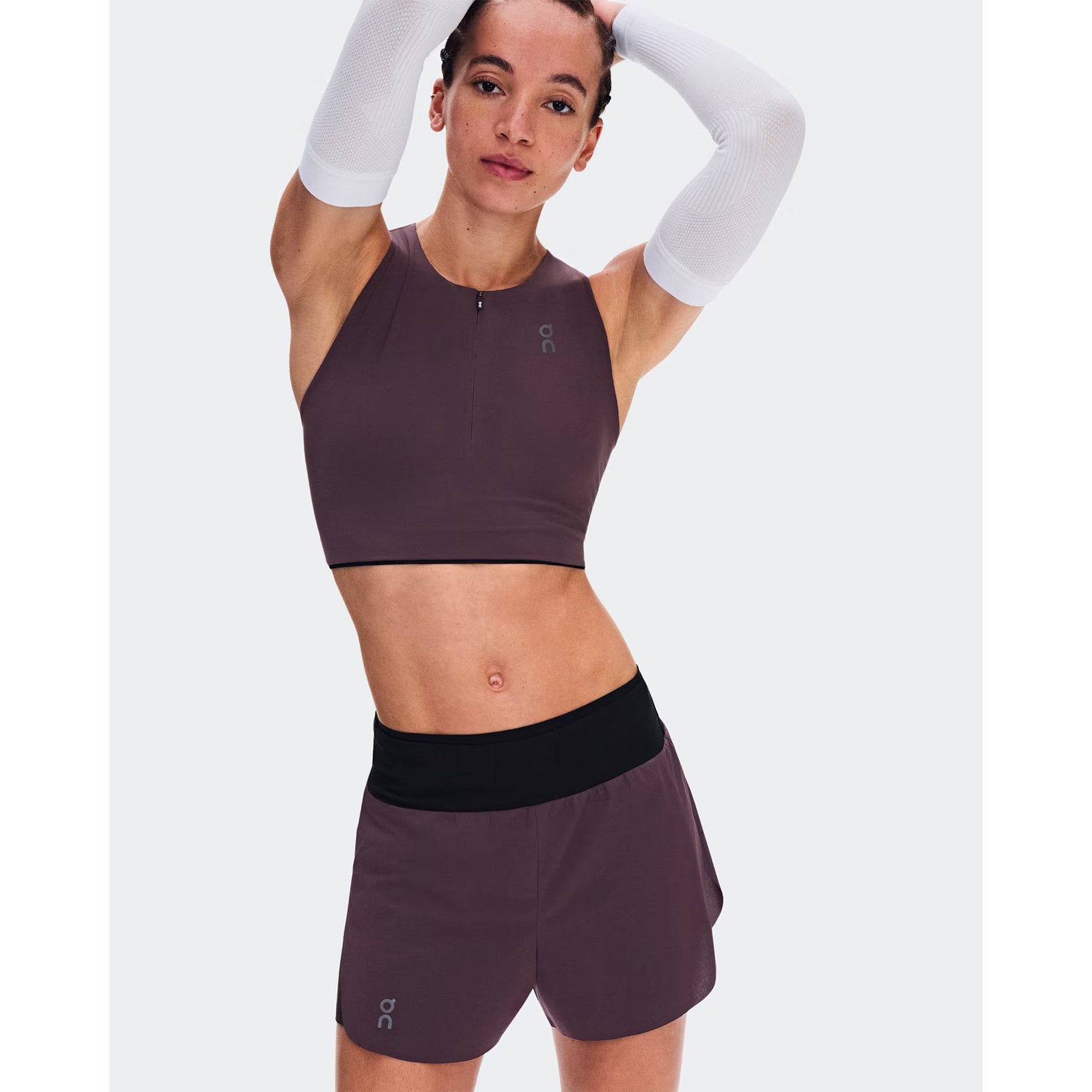 Women's On Zero 2-in-1 Shorts Urchin Black front view on female runner showing lightweight perforated outer with On athlete-inspired graphic and adjustable drawcord waistband for training performance