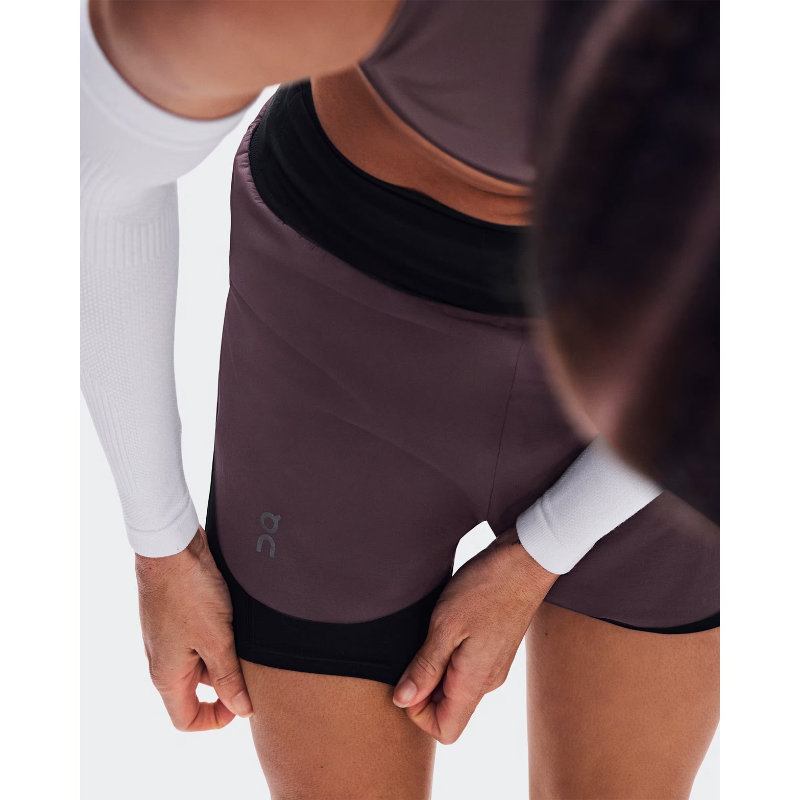 Women's On Zero 2-in-1 Shorts Urchin Black close-up of perforated outer showing ventilation construction for improved airflow during race pace and sustained training efforts