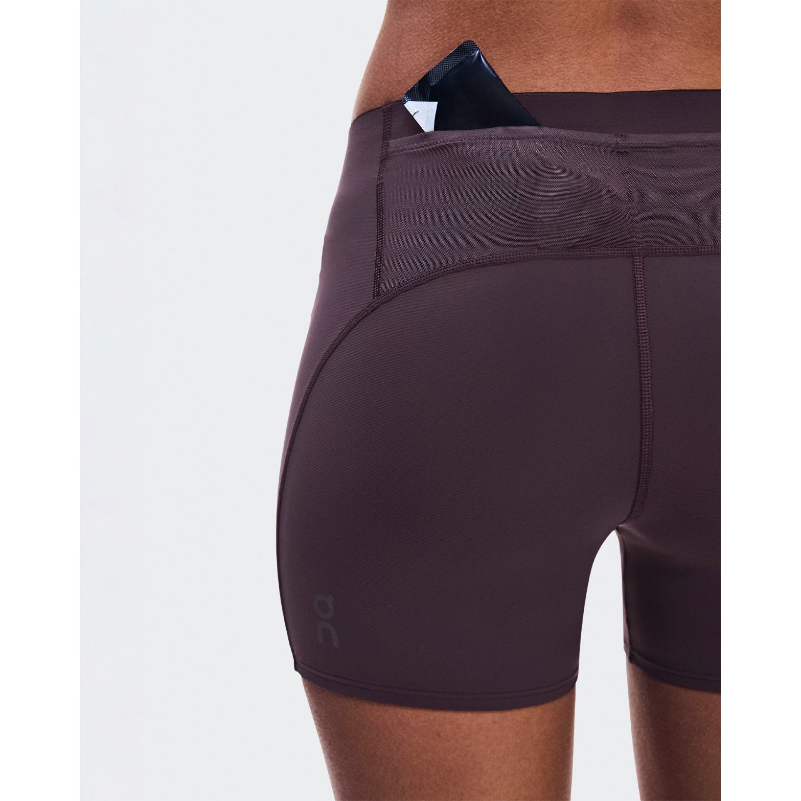 Women's On Zero Short Tights Urchin close-up of back pocket showing accessible gel storage with lightweight construction for practical race day nutrition without additional belts