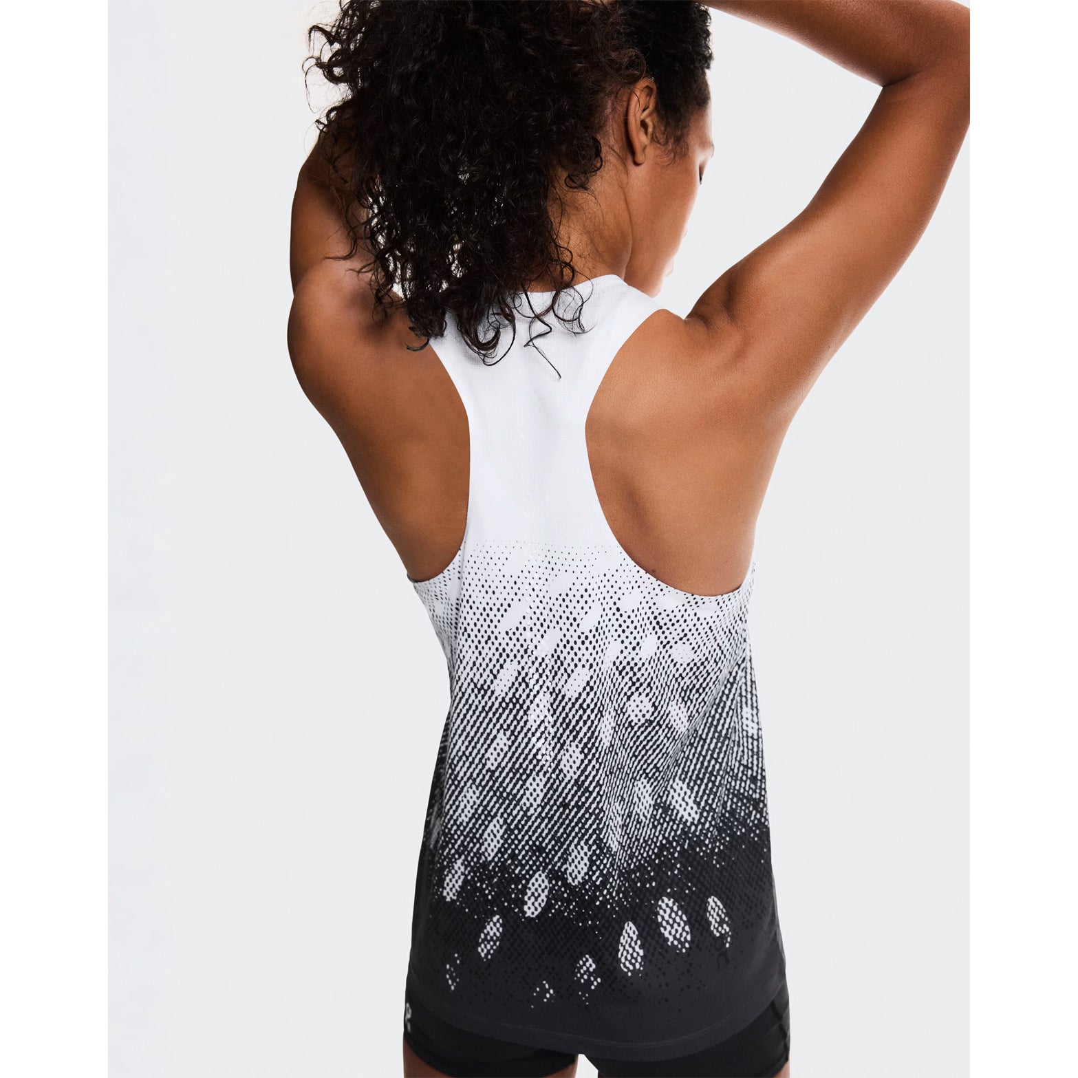 Women's On Zero Singlet White Black Grey back view on female runner showing athletic racer-back styling and ultra-lightweight construction