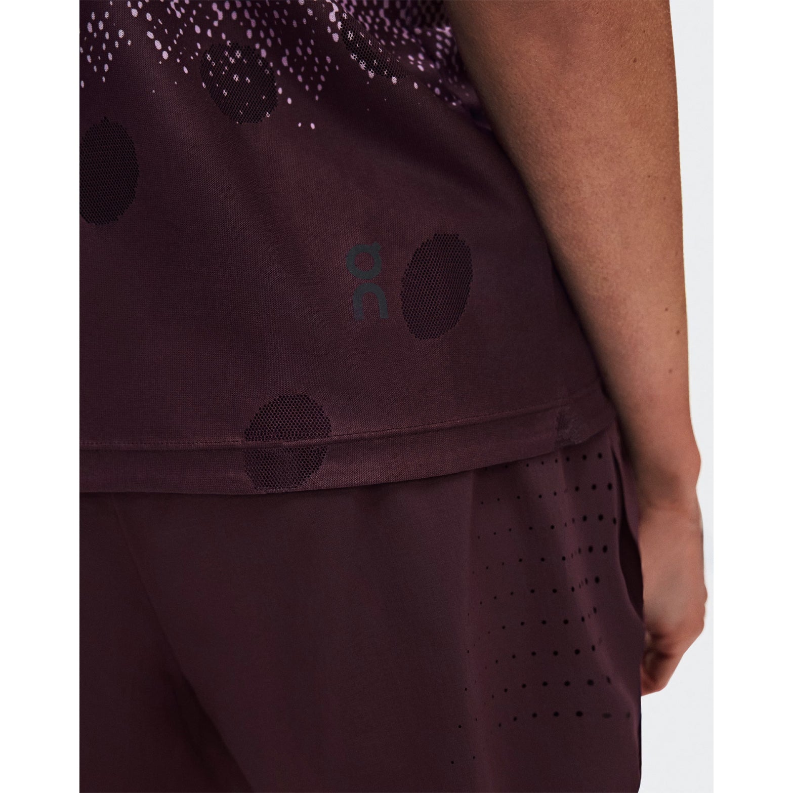 Women's On Zero Tank Breathe Foxglove White close-up of striking functional jacquard fabric showing On DryTec breathable moisture-wicking construction with minimal seams for ultralight distraction-free racing and training