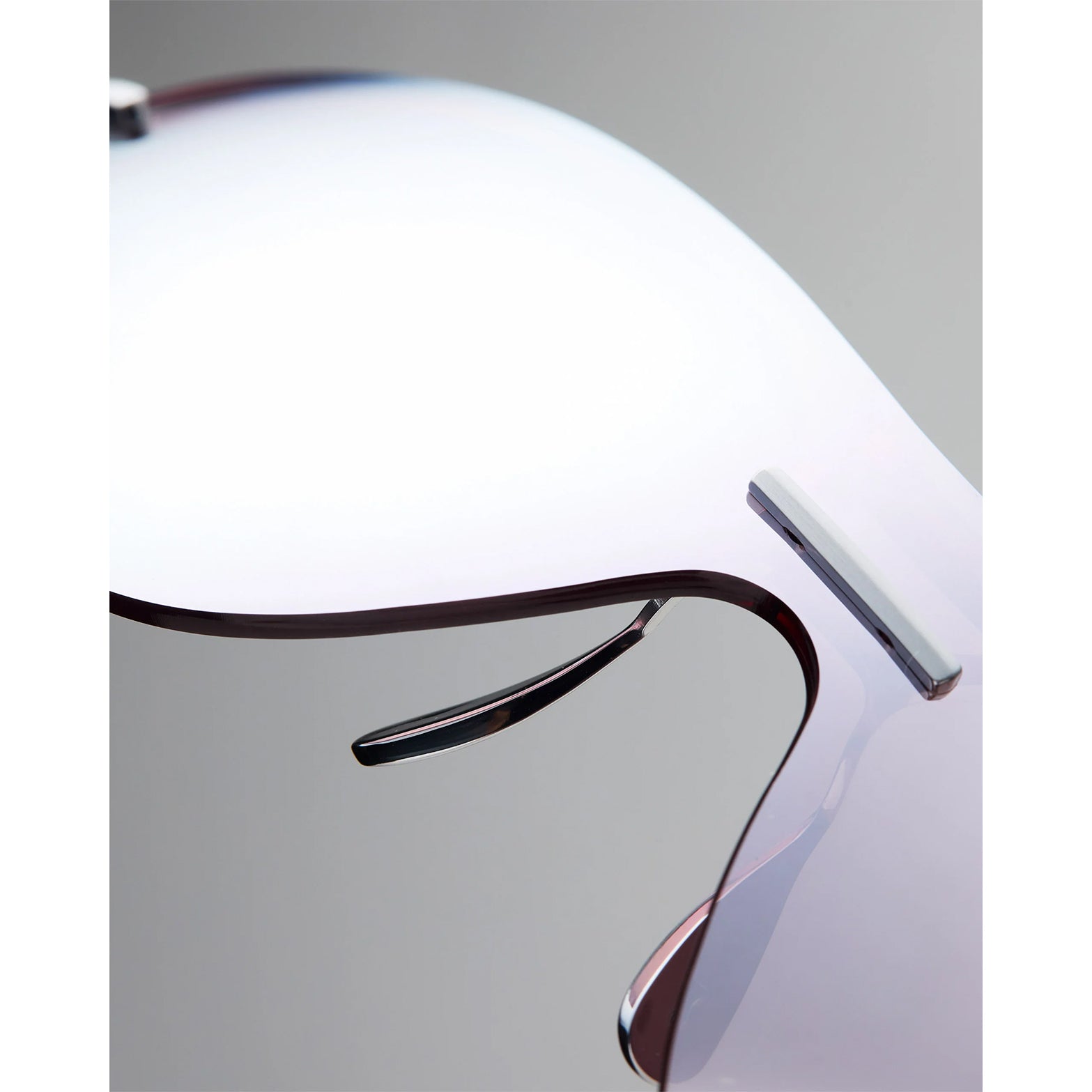 Soar x Cubitts Cirrus 02 Sunglasses in Silver — closeup showing ultralight titanium frame construction, custom ZEISS RiPel™ lens detail and silver colourway