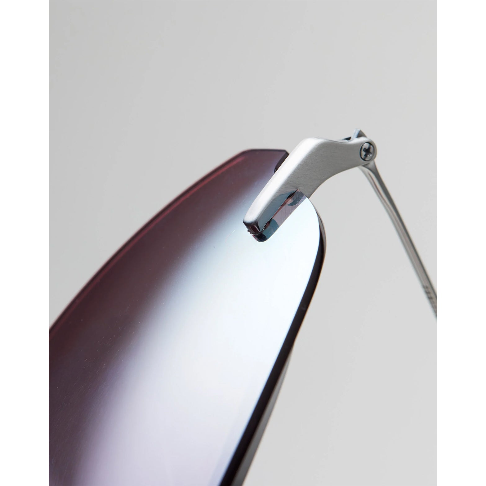 Soar x Cubitts Cirrus 02 Sunglasses in Silver — closeup showing crosshatched nose pad detail, beta titanium temple construction and silver ultralight titanium frame finish