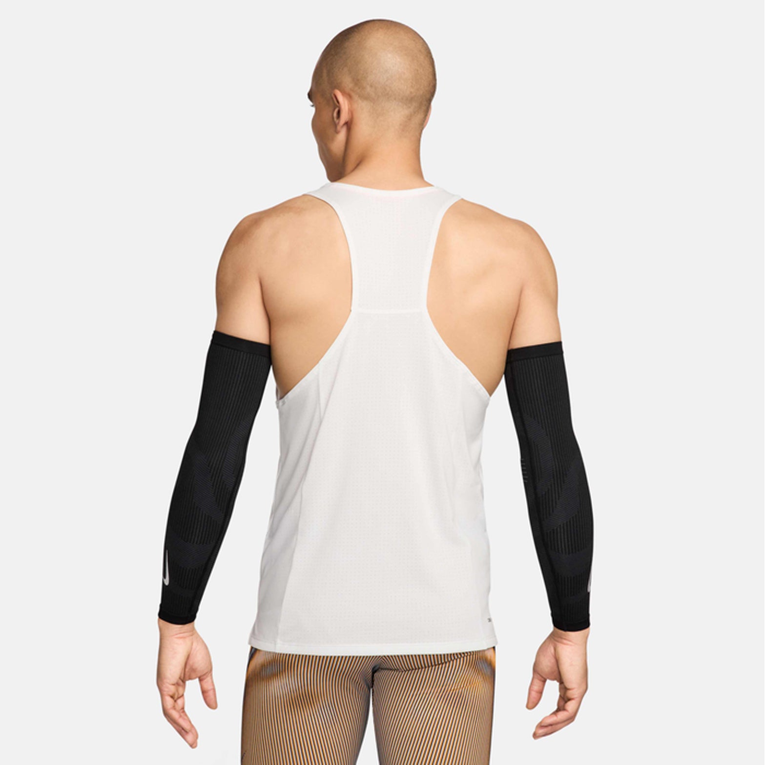 Nike Zoned Arm Sleeves in Black / Dark Smoke Grey / Silver — back view showing black dual-knit zoned construction with dark smoke grey heat-map targeted support and silver accent piping