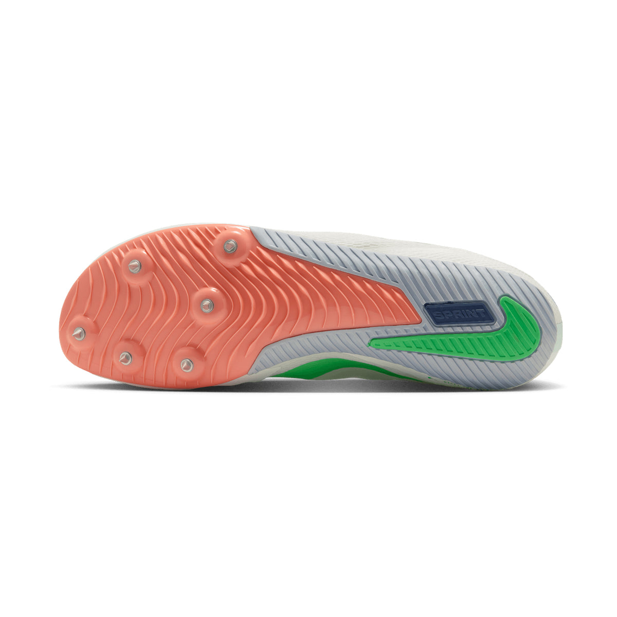 Close-up of a soccer cleat sole showcasing six metal studs, a wavy coral and grey tread pattern, and vibrant green and blue accents—including a green Nike swoosh and a blue SPRINT label—that channel the track speed inspiration from Nike’s Zoom Rival Sprint Running Spikes in Summit White, Electro Green, and Atomic Pink.